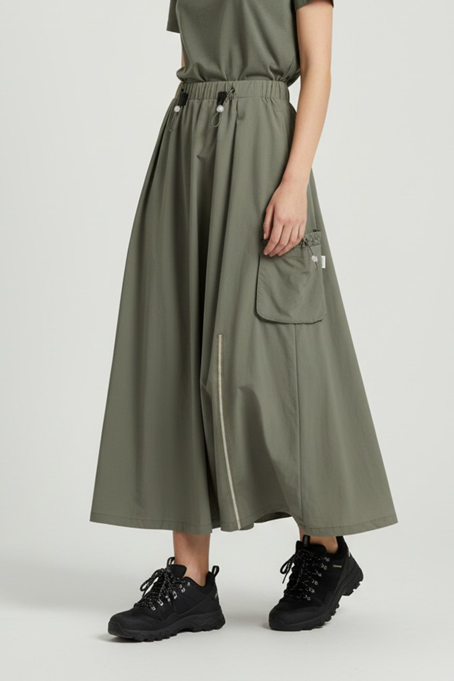 躍動機能 貼口袋抽皺下襬長裙(女)