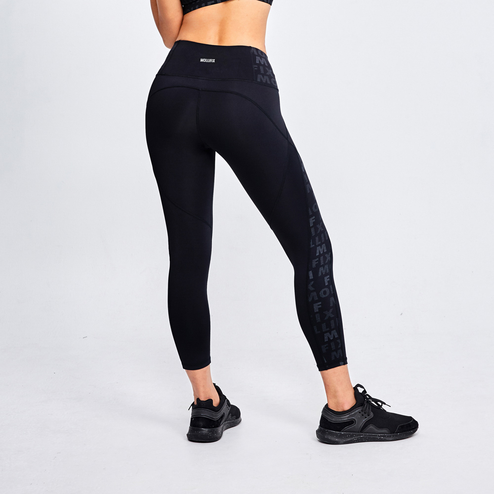 MOLLIFIX 滿版logo拼接修飾動塑褲