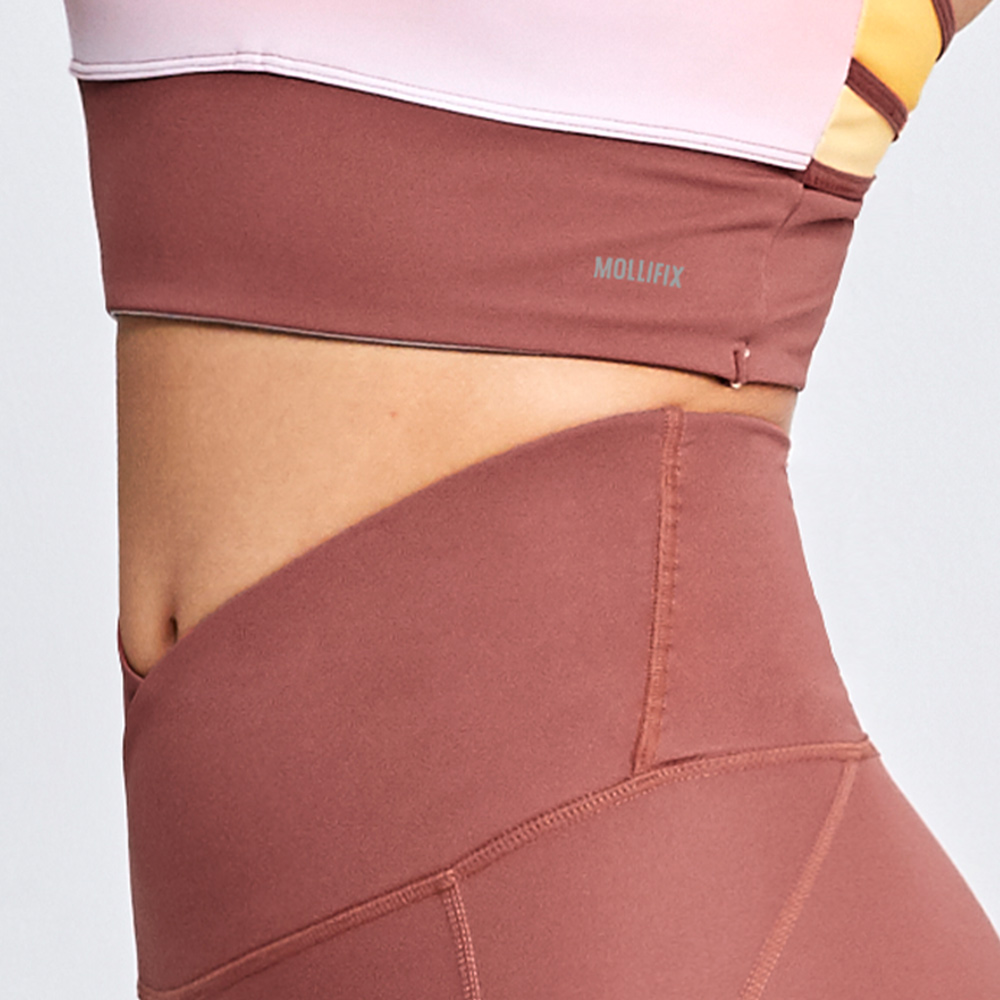 MOLLIFIX 前交叉高腰包覆7分褲