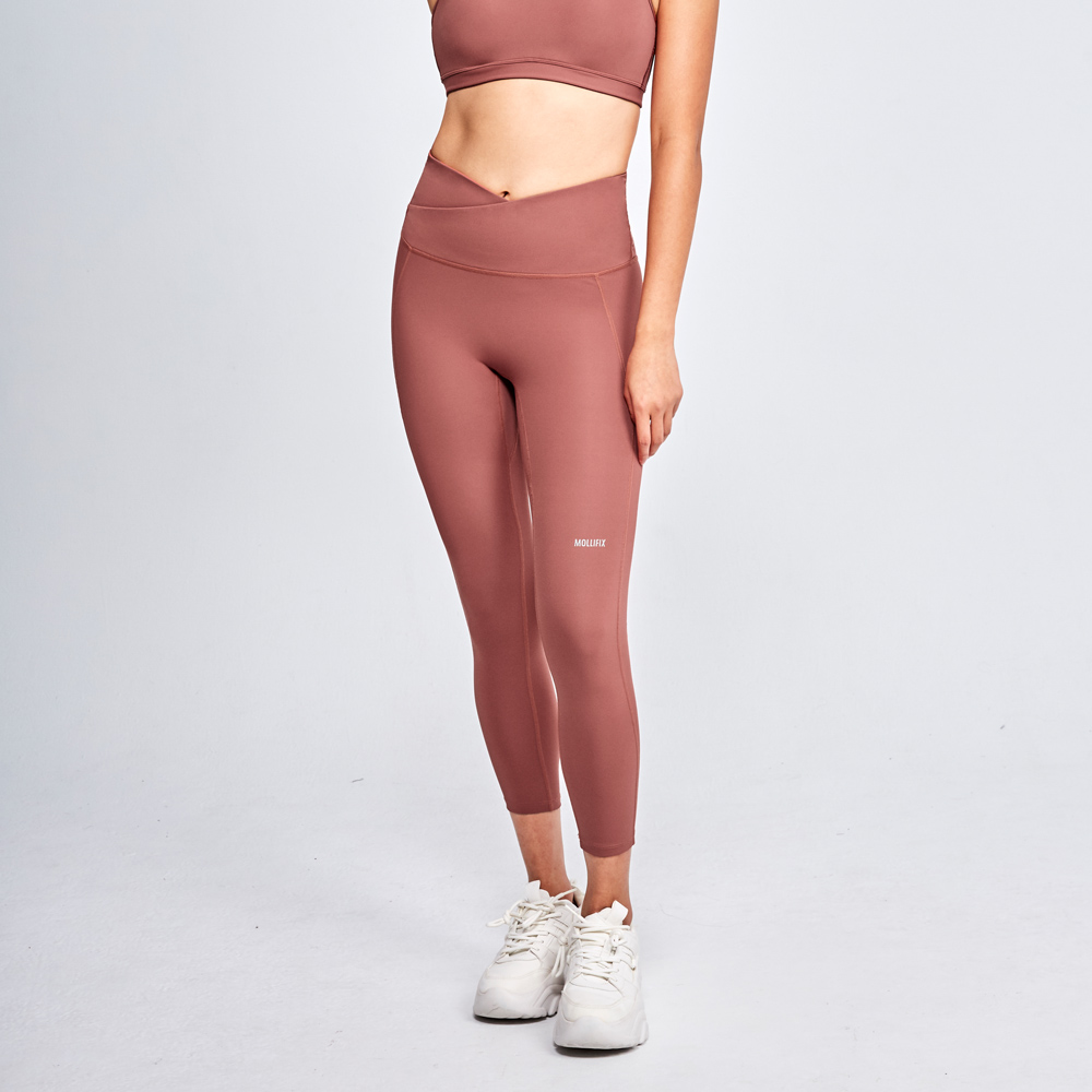 MOLLIFIX 前交叉高腰包覆7分褲